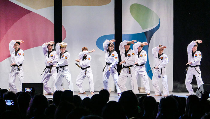 Members of the K-Tigers performance martial arts troupe give a taekwondo demonstration on the eve of Korea Day.