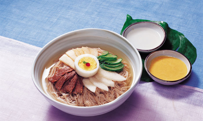 <i>Naengmyeon</i> is a noodle dish in a chilled broth. People used to love the dish, especially in the winter. The broth can be made with beef stock and <i>dongchimi</i> or <i>dongchimi</i> alone. In the summer, people also enjoy the dish with summer radish kimchi.