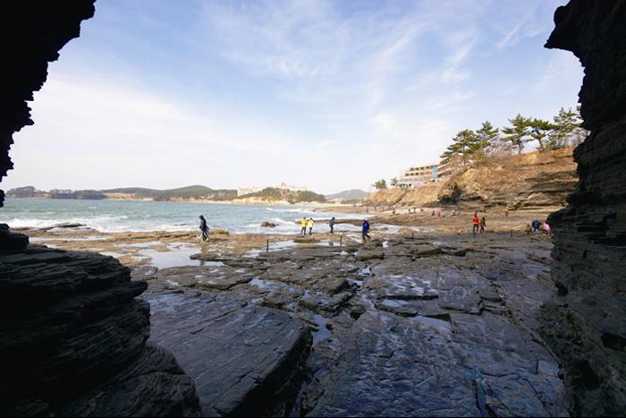 Sea seen from cave of Chaeseokgang Cliffs