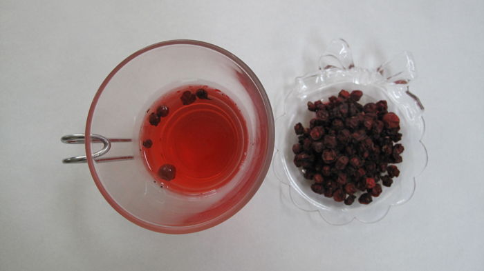 <i>Omija</i> tea and dried <i>omija</i> berries (image courtesy of the Rural Development Administration)