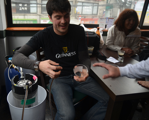 Troy Zitzelsberger offers his own beer in Maloney's Pub and Grill.
