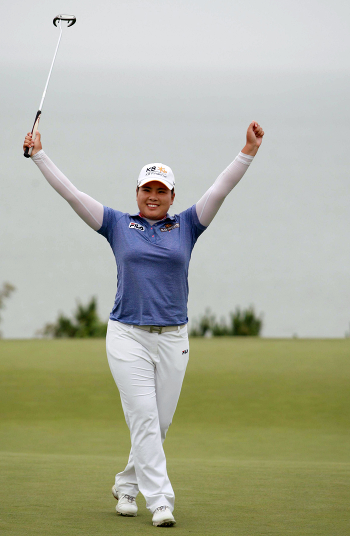 Park raises her arms to celebrate her victory after finishing the U.S. Women's Open on July 1 (photo courtesy of JB Worldwide).