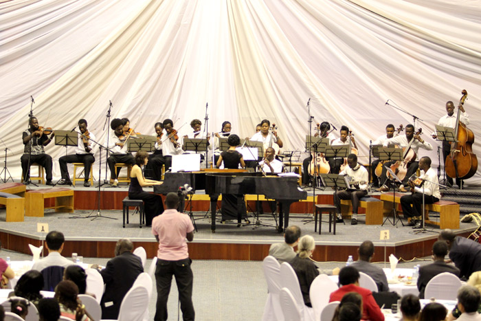 Maria Park (center, behind the piano) conducts the Youth Orchestra Africa. (photo courtesy of the Ministry of Foreign Affairs)