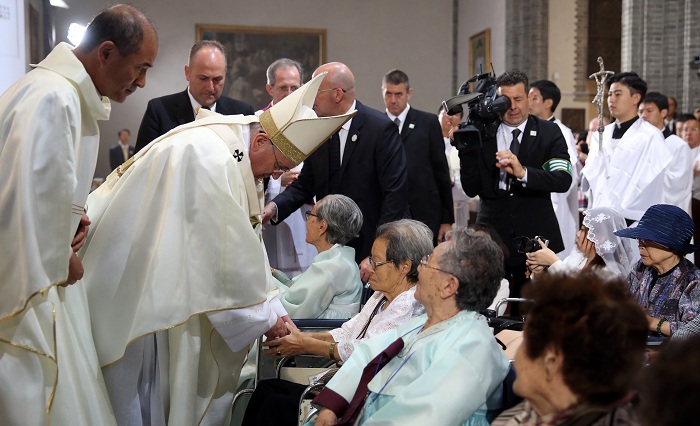 Pope Francis consoles surviving sexual slaves who were forced to work for the Japanese military during World War II.