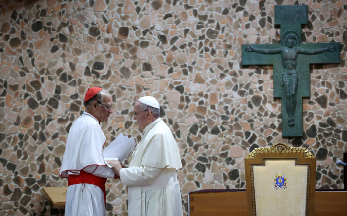 Pope Francis (right) exchanges greetings with bishops from across Asia.