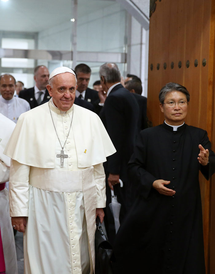 Pope Francis enters the church for a meeting with Asian bishops.
