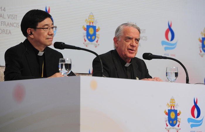Federico Lombardi, director of the Holy See Press Office, (right) explains the pope’s message during a meeting with Asian bishops.