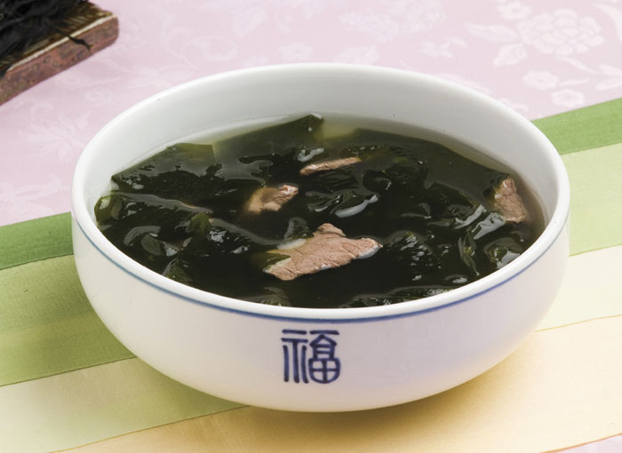 <i>Miyeokguk</i> is a soup made with soaked brown seaweed, shredded beef and a soy sauce seasoning. It's a must-eat dish for people on their birthdays or for people who have just given birth to new-born babies. One can add mussels or abalones or other ingredients, too, according to individual preference.
