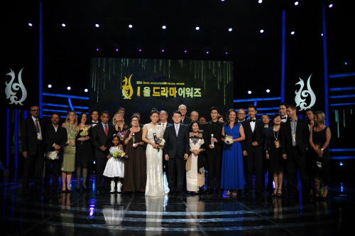 Winners of the 2014 Seoul International Drama Awards pose on stage. 