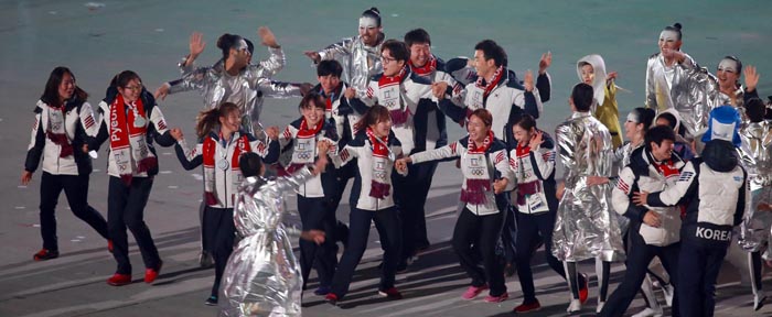Korean athletes mingle together during a performance to announce Pyeongchang as the next host city of the Winter Olympics. (photo: Yonhap News) 