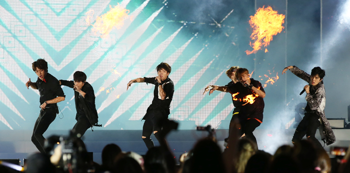 Boy band Infinite performs during the concert while receiving cheers from the crowd.