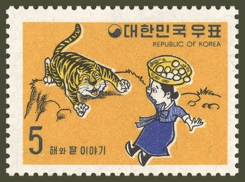 The first stamp of the 'Sun and Moon' series - A mother meets a tiger on her way home from work. (images courtesy of Korea Post)