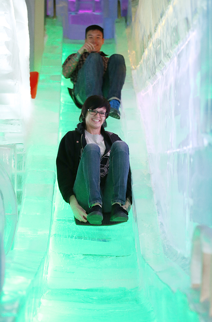 Sam (front), visiting the museum with her friend, enjoys going down the ice slide in the Ice Museum room at the Trickeye Museum. (photo: Jeon Han)