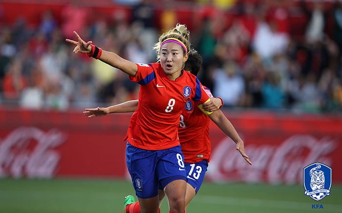 Cho Sohyun, No. 8, runs down the field to celebrate after heading in the equalizer during the first half of the match between Spain and Korea on June 17 in Ottawa. It was the final group stage game for both teams at the 2015 FIFA Women’s World Cup Canada.