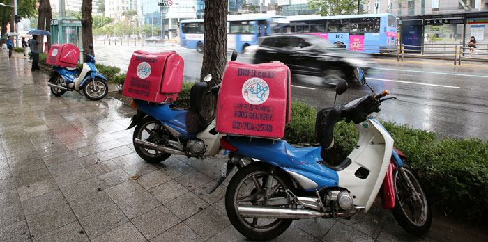 Bird Riders Food Delivery scooters are parked in front of their offices in Dongja-dong in Yongsan-gu District, Seoul.