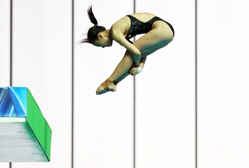  Gwangju Summer Universiade gold medalist Wang Ying from China dives in the women's platform diving competition. 