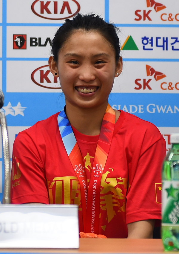 Wang Ying attends a press conference after winning her gold medal. 