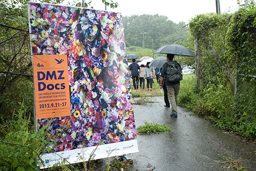 Visitors arrive at Camp Greaves, a former US army compound near the DMZ, for a Kim Jung-man photo exhibit taking place as part of the 4th annual DMZ Korean International Documentary Film Festival.