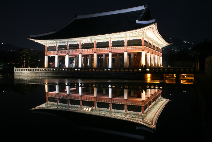 The Gyeonghoeru Pavilion at Gyeongbokgung Palace is lit at night.