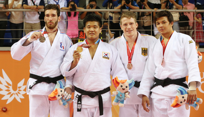 (From left) France's Clement Delvert (silver), Korea's Cho Guham (gold), Germany's Dino Pfeiffer (bronze) and Niiaz Bilalov from Russia (Bronze) celebrate on the podium after the men's -100 kilogram judo competition final on July 4.