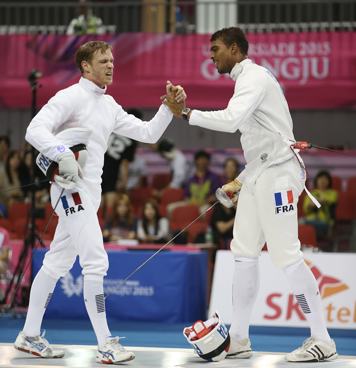  Yannick Philippe Andre Borel from France (right) shakes hands with Virgile Michel Louis Marchal also from France in the men's epee individual final after winning the gold medal. 