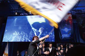 Lee Jung-hoon holds the team flag after winning at the GSTL finals in Las Vegas