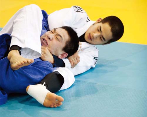 The South Korean men's national judo team is perfecting their throwing techniques to win Olympic gold.