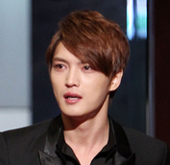 JYJ′s Kim Jae Joong Poses With a Bunch of Flowers for H...