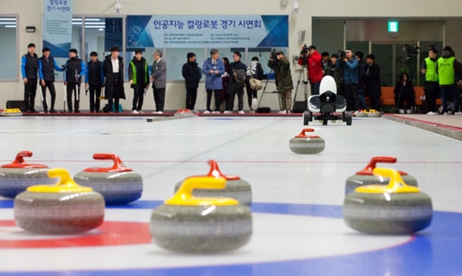 Curling robot vs. humans