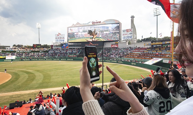 Augmented reality dragon wows baseball fans on opening day