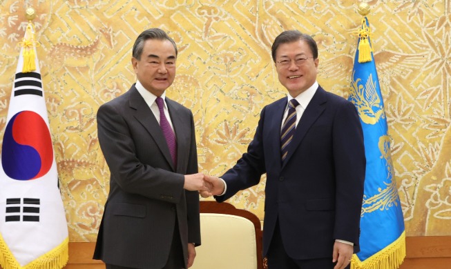 President Moon hosts talks with visiting Chinese FM Wang