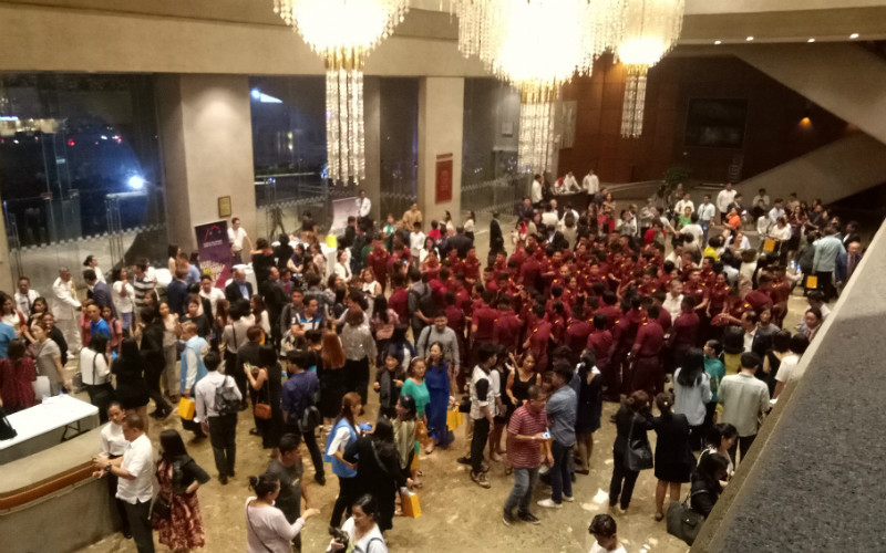 Crowds of audience members assemble at the lobby during the intermission.