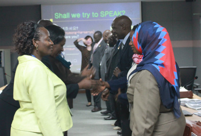 Ugandan officials take part in a welcoming ceremony on March 24.