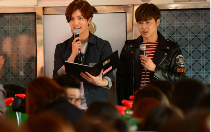 The members of TVXQ, Max Changmin (left) and U-know Yunho, hosted a train trip across Korea for around 250 of their fans on March 24.