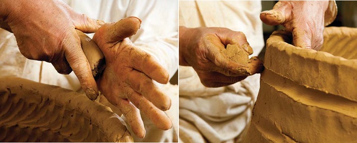 (20) As the layers of the side are put in place, the craftsman uses his index finger to "pinch" the two layers together. (21) The outside of the urn is also sealed using the fingers. 