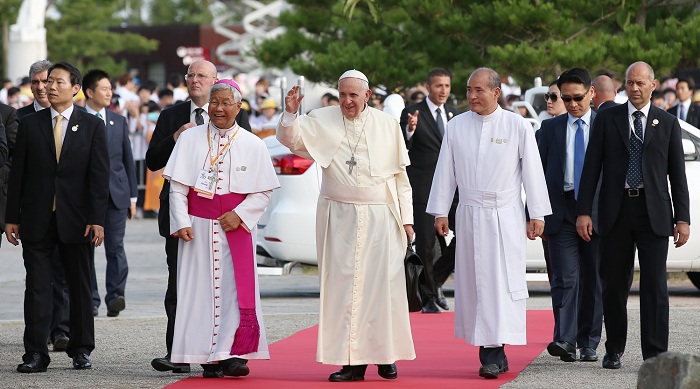 Pope Francis greets believers as he arrives at the birthplace of St. Andrew Kim Dae-geon at the Solmoe Sanctuary in Danjin, Chungcheongnam-do, on August 15.