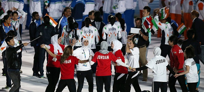 Representatives of each nation gather in the stadium to celebrate the closing ceremony.