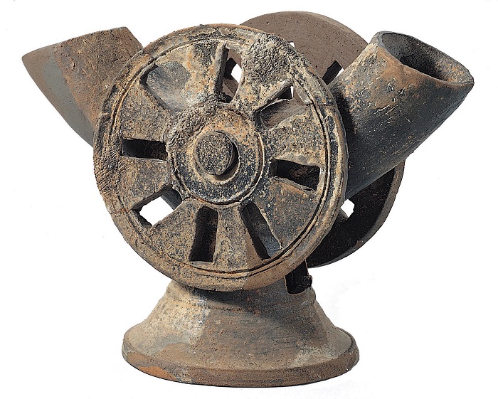 Pictured is a piece of pottery with a wheel pattern. It is believed that it was used to hold alcohol and other beverages during ritual ceremonies. It would also help the souls of the dead enter the afterworld.