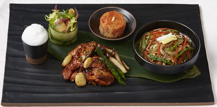 White kimchi noodles and kimchi with stir-fried glass noodles and vegetables.