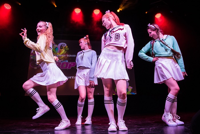A four-member girl group dances during the 2015 K-Pop Festival at the Palladium theater in Warsaw.