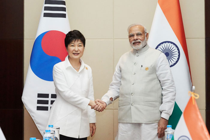 President Park Geun-hye shakes hands with her Indian counterpart Narendra Modi on the sidelines of the East Asia Summit, a regional strategic forum, in the Laotian capital of Vientiane on Sept. 8. (Photo: Cheong Wa Dae)