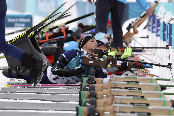Oksana Masters of the U.S. shoots while training at the Alpensia Biathlon Centre in PyeongChang, Gangwon-do Province, on March 9. She said she will win the gold medal for her mother who helped her make her dreams come true.
