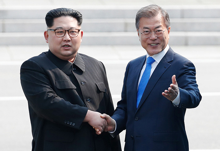 President Moon Jae-in and North Korean Chairman of the State Affairs Committee Kim Jong Un shake hands in front of the Military Demarcation Line in Panmunjeom on April 27.