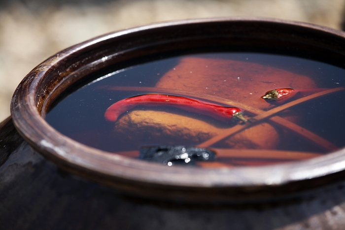 Ganjang (soy sauce), and doenjang (soybean paste), are made by fermenting the bricks of soybean in salted water.