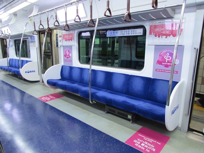  
In 
 Korean subways, there are seats marked with pink reserved for pregnant women. 