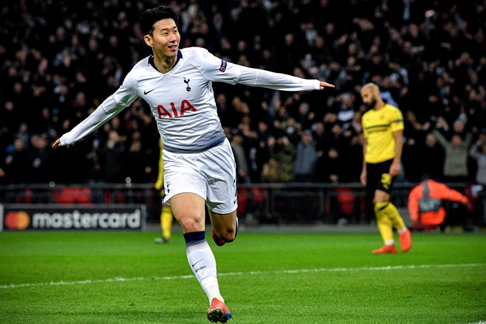 Tottenham Hotspur forward Son Heung-min on Feb. 13 celebrates after scoring the opening goal against Borussia Dortmund in the first leg of a round of 16 match in the UEFA Champions League at London’s Wembley Stadium. (Yonhap News)