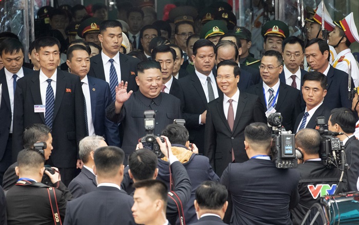 North Korean leader Kim Jong Un on Feb. 26 waves to welcoming crowds after arriving at Dong Dang Station in the Sino-Vietnamese border town of Dong Dang in Vietnam’s Lang Song province.