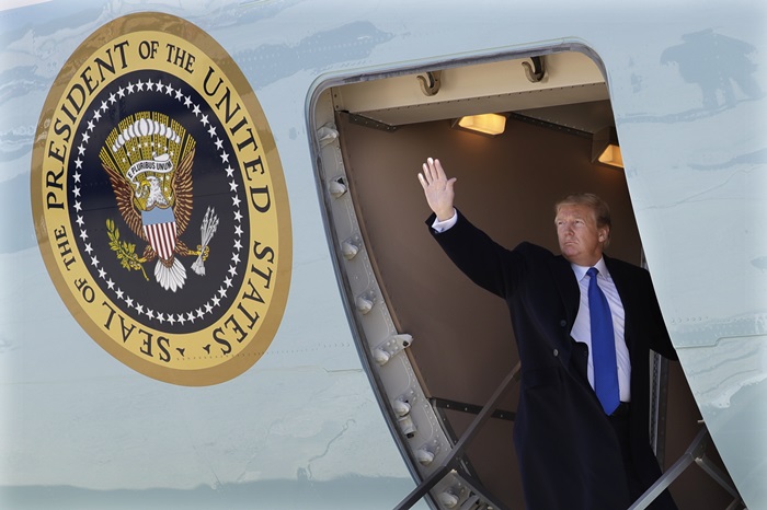 U.S. President Donald Trump on Feb. 25 waves before boarding Air Force One to fly to Hanoi, Vietnam, from Joint Base Andrews in Maryland.