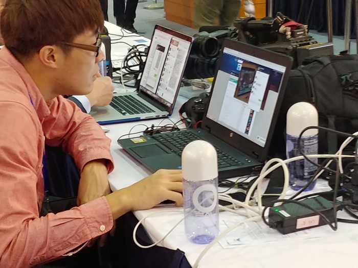 A Korean brand of bottled water is seen on Feb. 28 at 9 a.m. atop the desks of reporters at the International Media Center for the second North Korea-U.S. summit in Hanoi, Vietnam.