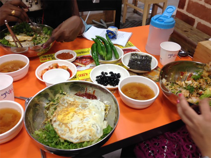 Here, I try bibimbap for the first time in the U.S.